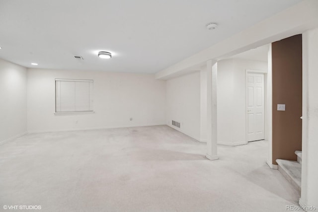 basement with light colored carpet