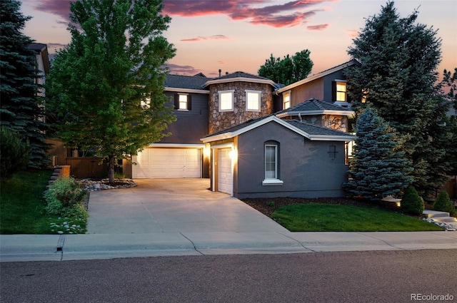 2832 Danbury Ave, Highlands Ranch, CO 80126 - front facade with driveway, stone siding, stucco siding, and a garage