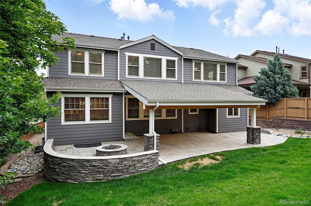 2832 Danbury Ave, Highlands Ranch, CO 80126 - rear view of house with a fire pit, a patio, and a shingled roof