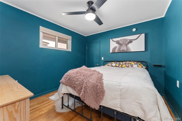 511 S Pennsylvania St, Denver, CO 80209 - bedroom featuring ornamental molding, wood finished floors, and a ceiling fan