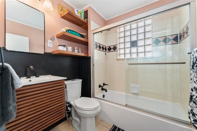 511 S Pennsylvania St, Denver, CO 80209 - bathroom featuring toilet, crown molding, tile patterned flooring, bath / shower combo with glass door, and vanity