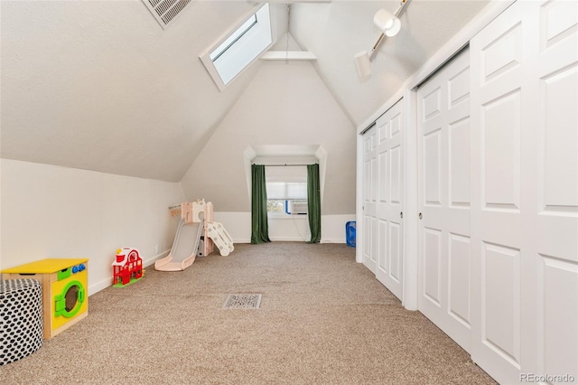 511 S Pennsylvania St, Denver, CO 80209 - game room featuring carpet flooring, lofted ceiling, baseboards, cooling unit, and a skylight