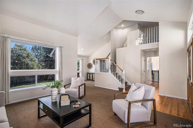 8825 Fairview Oaks Pl, Lone Tree, CO 80124 - living room featuring stairs, high vaulted ceiling, carpet floors, and recessed lighting