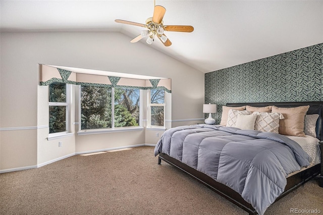 8825 Fairview Oaks Pl, Lone Tree, CO 80124 - carpeted bedroom featuring an accent wall, wallpapered walls, lofted ceiling, and ceiling fan