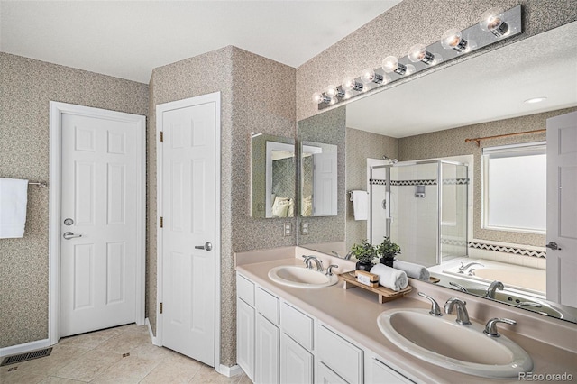 8825 Fairview Oaks Pl, Lone Tree, CO 80124 - full bath with a stall shower, double vanity, a garden tub, tile patterned floors, and wallpapered walls