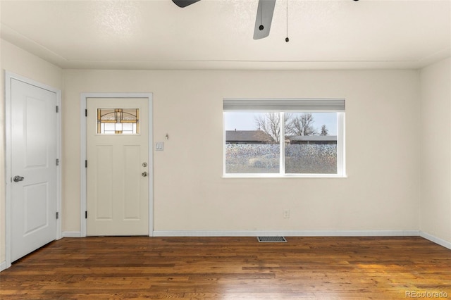 entryway with wood finished floors, visible vents, baseboards, and ceiling fan