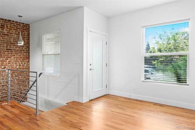 1211 E 26th Ave, Denver, CO 80205 - entryway featuring wood finished floors and baseboards