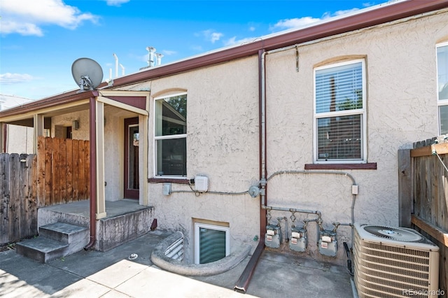 1211 E 26th Ave, Denver, CO 80205 - rear view of property with stucco siding and central AC unit