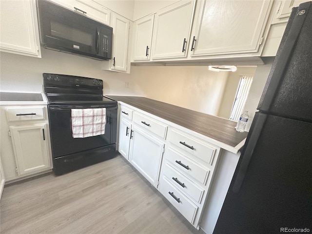 56 S Nome St, Aurora, CO 80012 - kitchen with black appliances, white cabinets, and light wood-type flooring