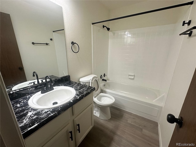 56 S Nome St, Aurora, CO 80012 - bathroom featuring wood finished floors, shower / tub combination, vanity, and a textured wall