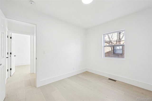 empty room with light wood-type flooring