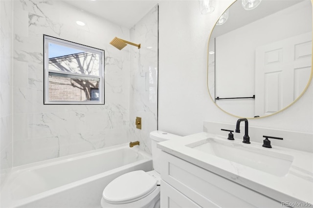 full bathroom featuring tiled shower / bath combo, vanity, and toilet