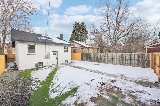 view of snow covered house