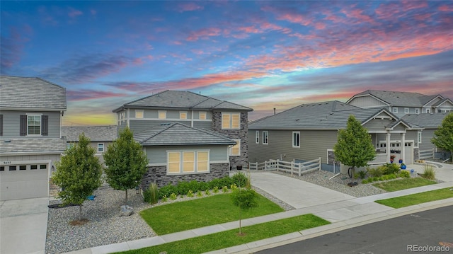 3453 Pacific Peak Dr, Broomfield, CO 80023 - traditional-style home with stone siding, concrete driveway, and a garage