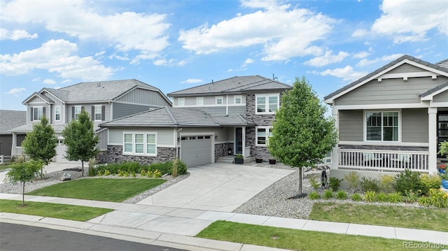 3453 Pacific Peak Dr, Broomfield, CO 80023 - craftsman-style home featuring an attached garage, stone siding, concrete driveway, and a front yard