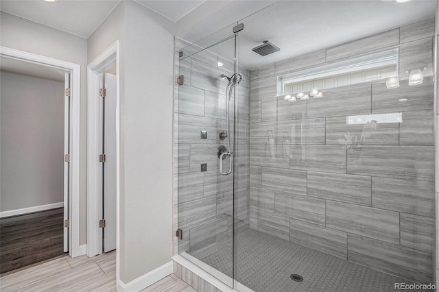 3453 Pacific Peak Dr, Broomfield, CO 80023 - full bath featuring a shower stall and baseboards