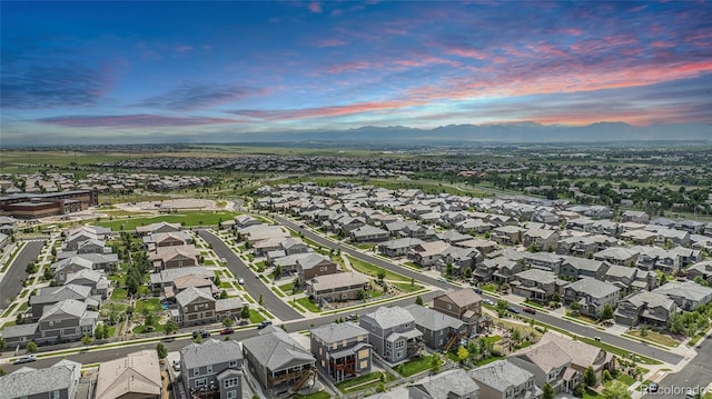 3453 Pacific Peak Dr, Broomfield, CO 80023 - aerial view at dusk of a mountain view and a residential view