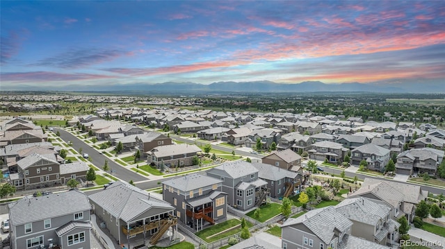 3453 Pacific Peak Dr, Broomfield, CO 80023 - aerial perspective of suburban area featuring a mountainous background