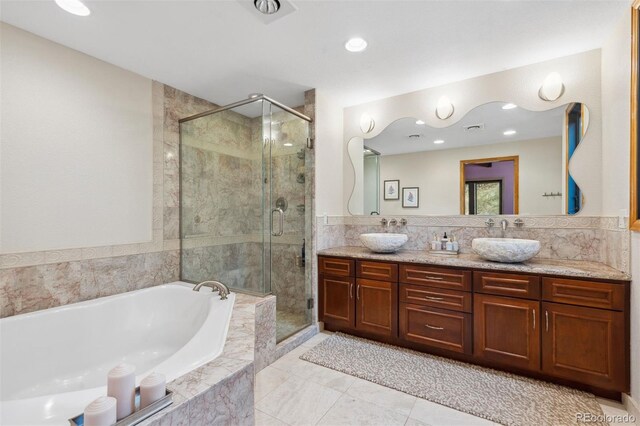 bathroom with shower with separate bathtub and vanity