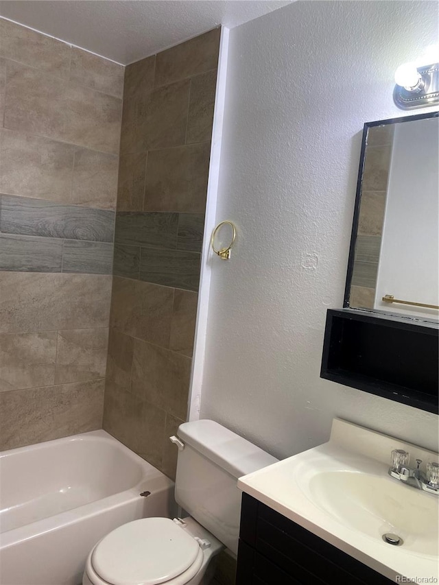 full bathroom with vanity, toilet, and tiled shower / bath