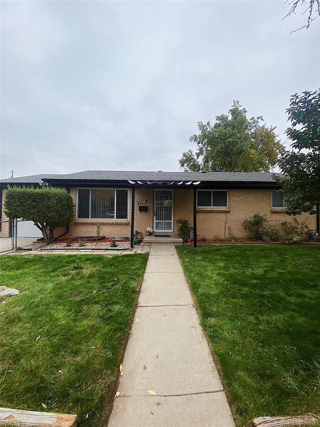 3000 Billings St, Aurora, CO 80011 - single story home with brick siding