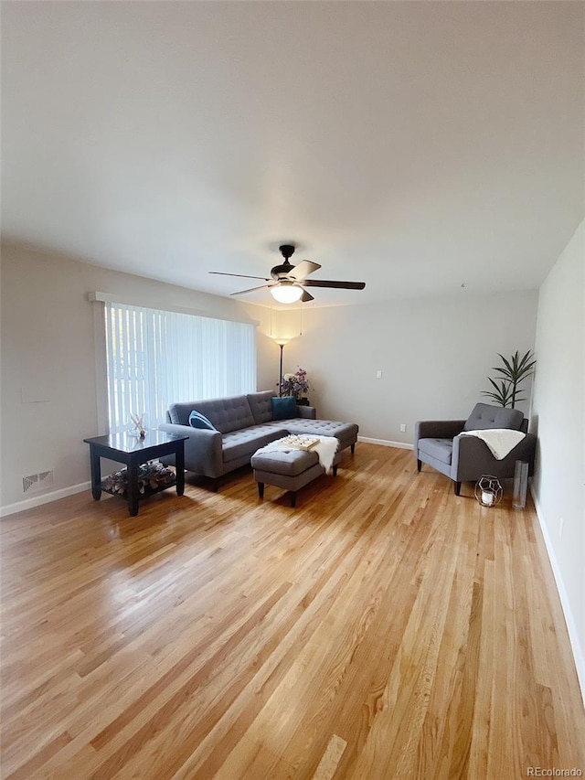 3000 Billings St, Aurora, CO 80011 - living room featuring light wood-type flooring, ceiling fan, and baseboards