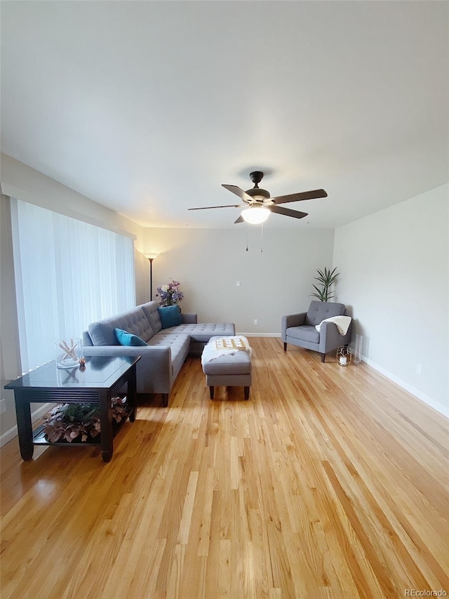 3000 Billings St, Aurora, CO 80011 - living area with light wood finished floors, ceiling fan, and baseboards
