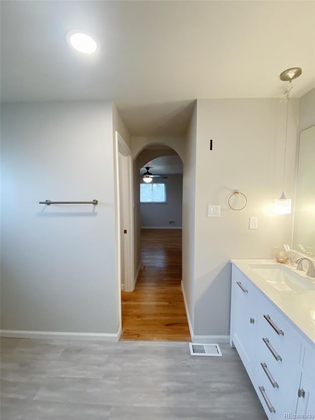 3000 Billings St, Aurora, CO 80011 - bathroom with double vanity, wood finished floors, and baseboards