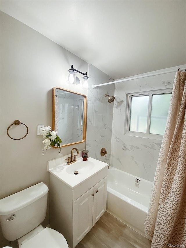 3000 Billings St, Aurora, CO 80011 - full bathroom with toilet, vanity, shower / bath combo with shower curtain, and wood finished floors