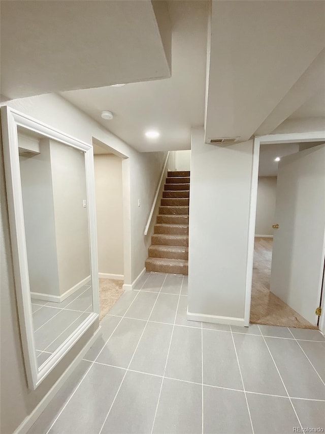 3000 Billings St, Aurora, CO 80011 - finished below grade area with light tile patterned flooring, stairs, and baseboards