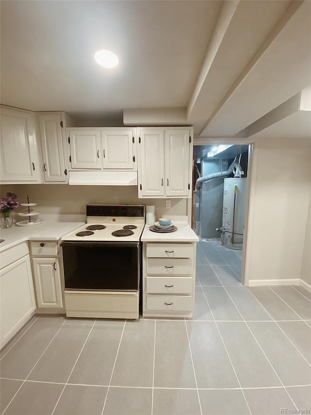 3000 Billings St, Aurora, CO 80011 - kitchen with range with electric stovetop, under cabinet range hood, light tile patterned floors, and water heater