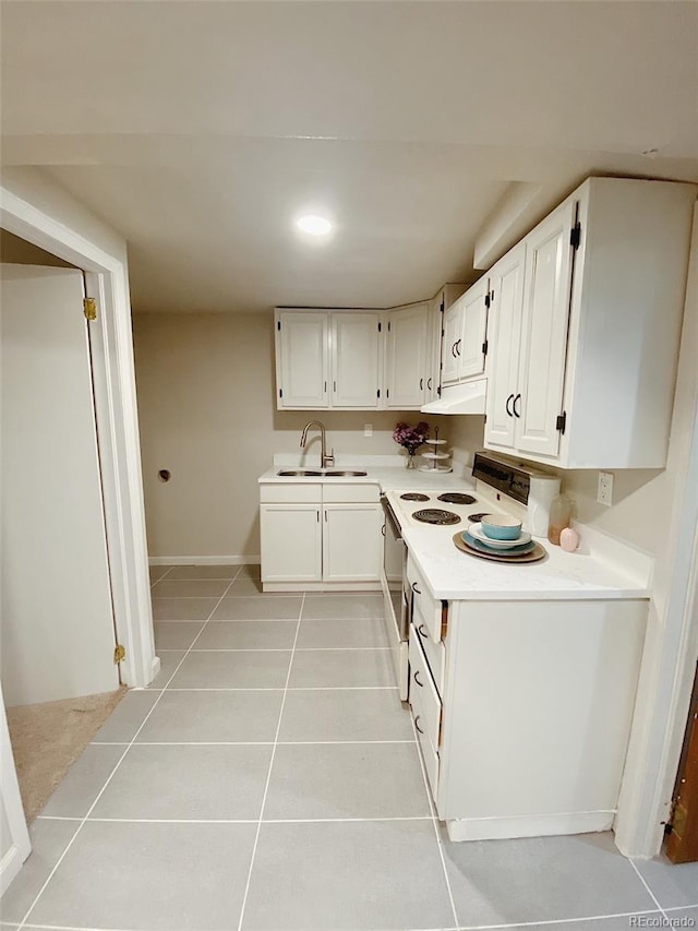 3000 Billings St, Aurora, CO 80011 - kitchen with a sink, electric stove, under cabinet range hood, white cabinetry, and recessed lighting