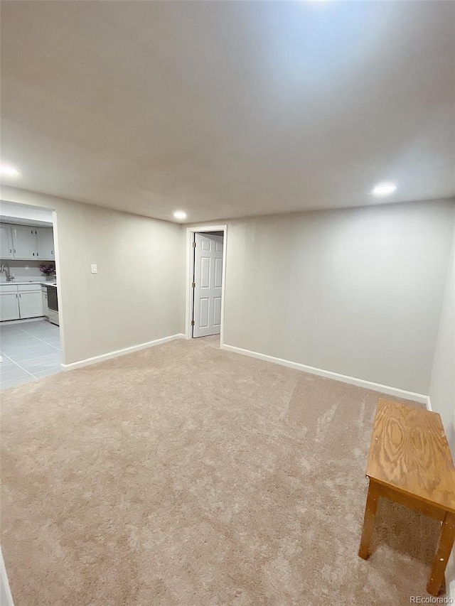 3000 Billings St, Aurora, CO 80011 - finished below grade area with light colored carpet, baseboards, a sink, and recessed lighting
