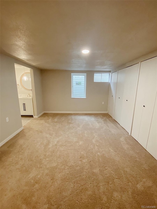 3000 Billings St, Aurora, CO 80011 - basement featuring light colored carpet and baseboards