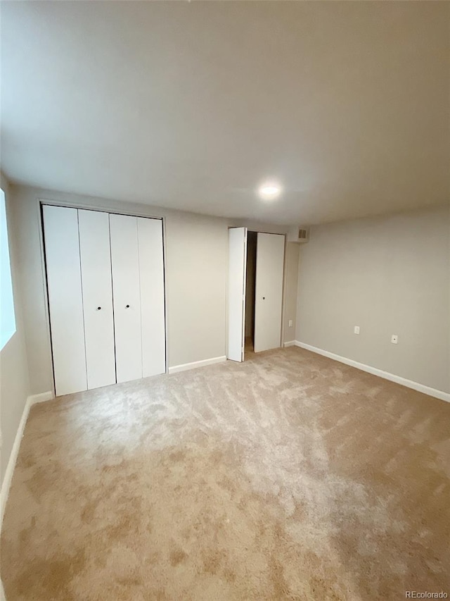 3000 Billings St, Aurora, CO 80011 - unfurnished bedroom with multiple closets, light carpet, and baseboards