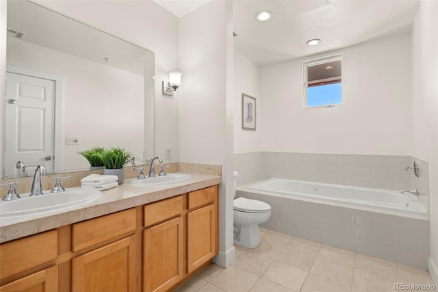 full bathroom featuring a sink, visible vents, a garden tub, and tile patterned flooring