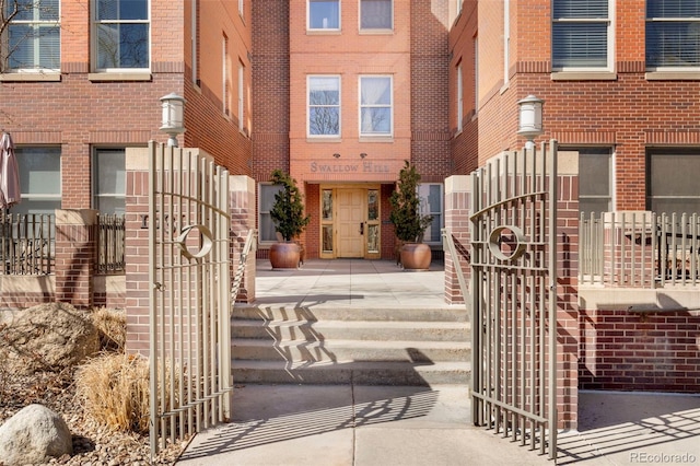 property entrance with brick siding