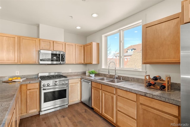 kitchen featuring dark wood-style floors, recessed lighting, a sink, light brown cabinetry, and appliances with stainless steel finishes