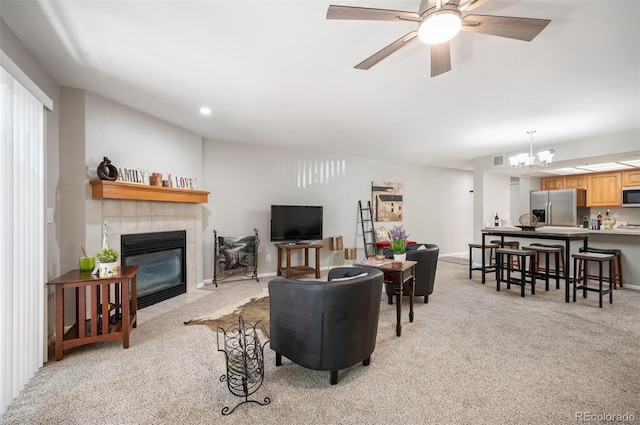 23612 Pondview Pl Unit A, Golden, CO 80401 - living area with light carpet, a tile fireplace, a chandelier, and recessed lighting
