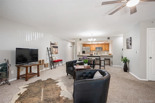 23612 Pondview Pl Unit A, Golden, CO 80401 - living area with light colored carpet, ceiling fan, and a chandelier