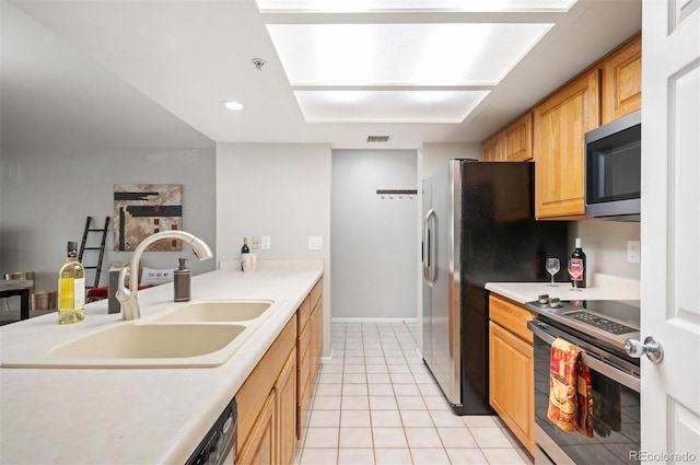 23612 Pondview Pl Unit A, Golden, CO 80401 - kitchen with appliances with stainless steel finishes, light tile patterned floors, light countertops, a peninsula, and recessed lighting
