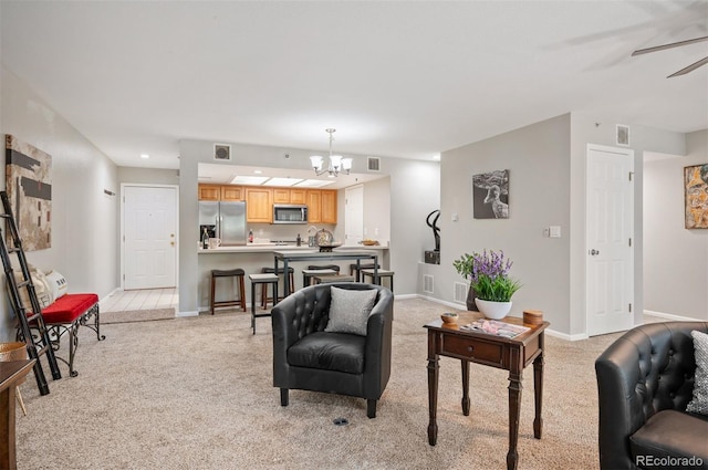 23612 Pondview Pl Unit A, Golden, CO 80401 - living room with a chandelier, light carpet, a ceiling fan, and recessed lighting