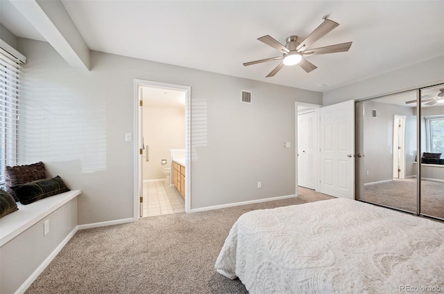 23612 Pondview Pl Unit A, Golden, CO 80401 - bedroom featuring light carpet, ensuite bath, ceiling fan, and a closet
