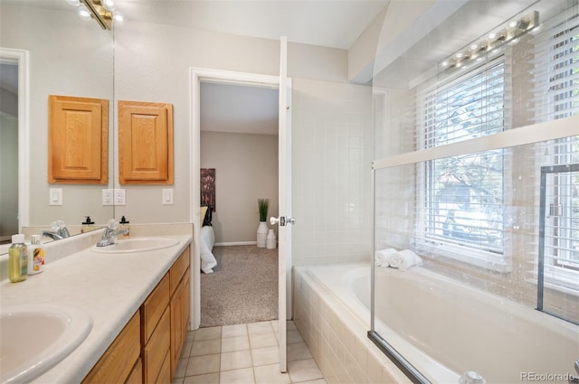 23612 Pondview Pl Unit A, Golden, CO 80401 - ensuite bathroom with tiled bath, double vanity, and tile patterned floors