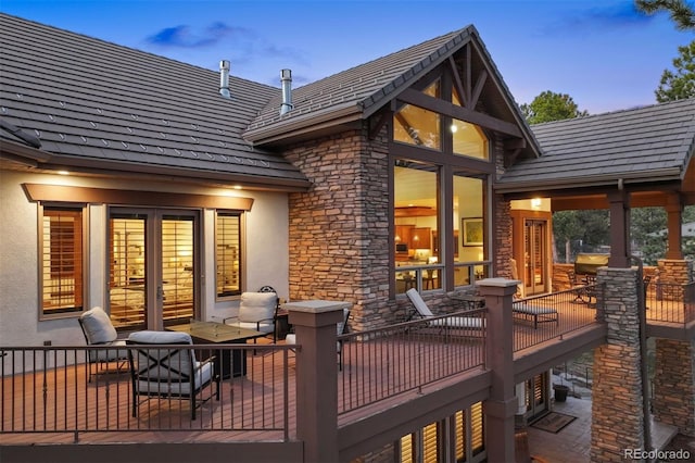 deck at dusk with french doors