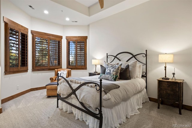 carpeted bedroom with recessed lighting, visible vents, and baseboards