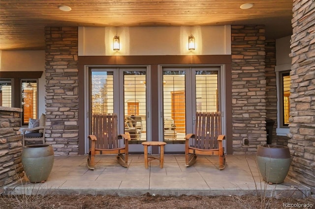 doorway to property with a patio area and french doors