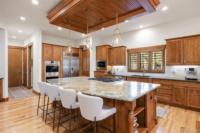 kitchen with built in appliances, a sink, wood ceiling, a kitchen island, and recessed lighting