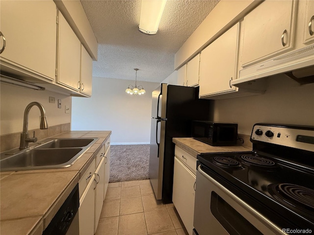 7695 E Quincy Ave Unit 207, Denver, CO 80237 - kitchen with stainless steel electric range, black microwave, a textured ceiling, ventilation hood, and white cabinets