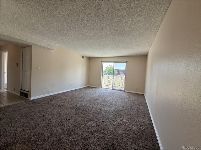 7695 E Quincy Ave Unit 207, Denver, CO 80237 - carpeted spare room with a textured ceiling and baseboards